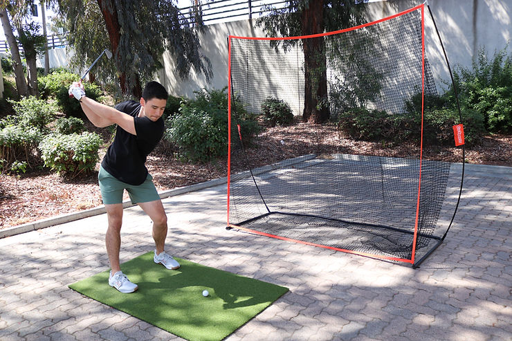 a man hitting a tennis ball with a tennis racquet.