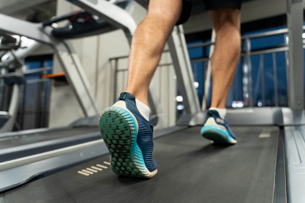 Man walking on treadmill in gym