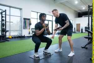 Patient working with a provider at a sports physical therapy clinic in Torrance