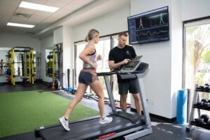 Patient working with a provider at a running physical therapy clinic in Torrance, CA during a running gait analysis session
