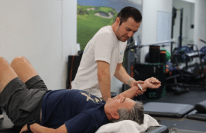 Patient receiving manual therapy for shoulder pain at a sports physical therapy clinic in Torrance, CA